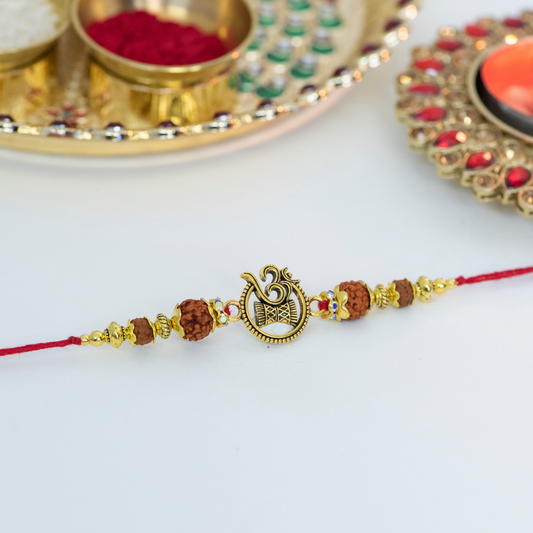 Cutout Aum & Damru with Jhumkis Designer Rakhi