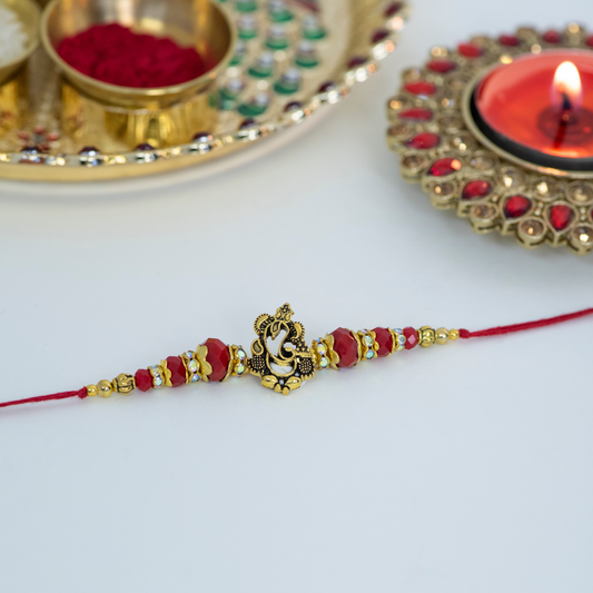 Gold Cutout Ganesha with Rudraksh Designer Rakhi