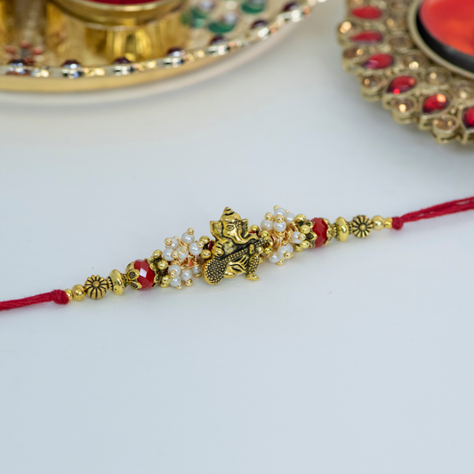 Genesha Playing Sitar with Aum Designer Rakhi