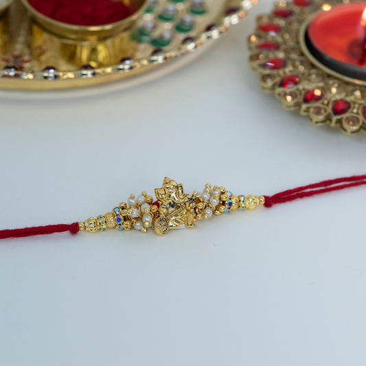 Genesha Playing Sitar with Jumkis Rakhi