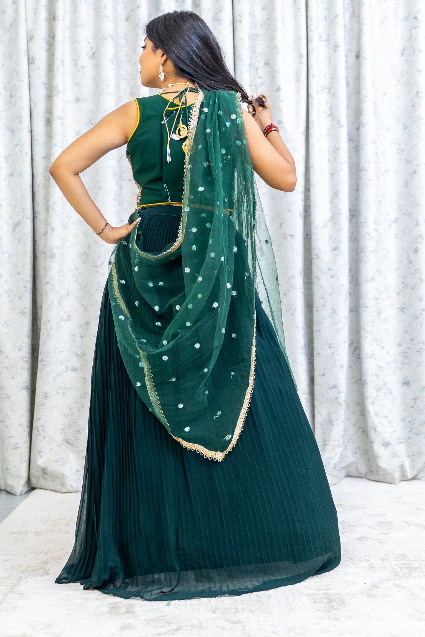 Emerald Green Chiffon Crimped Lehenga Choli with Embroidery and Swarovski Stone Work