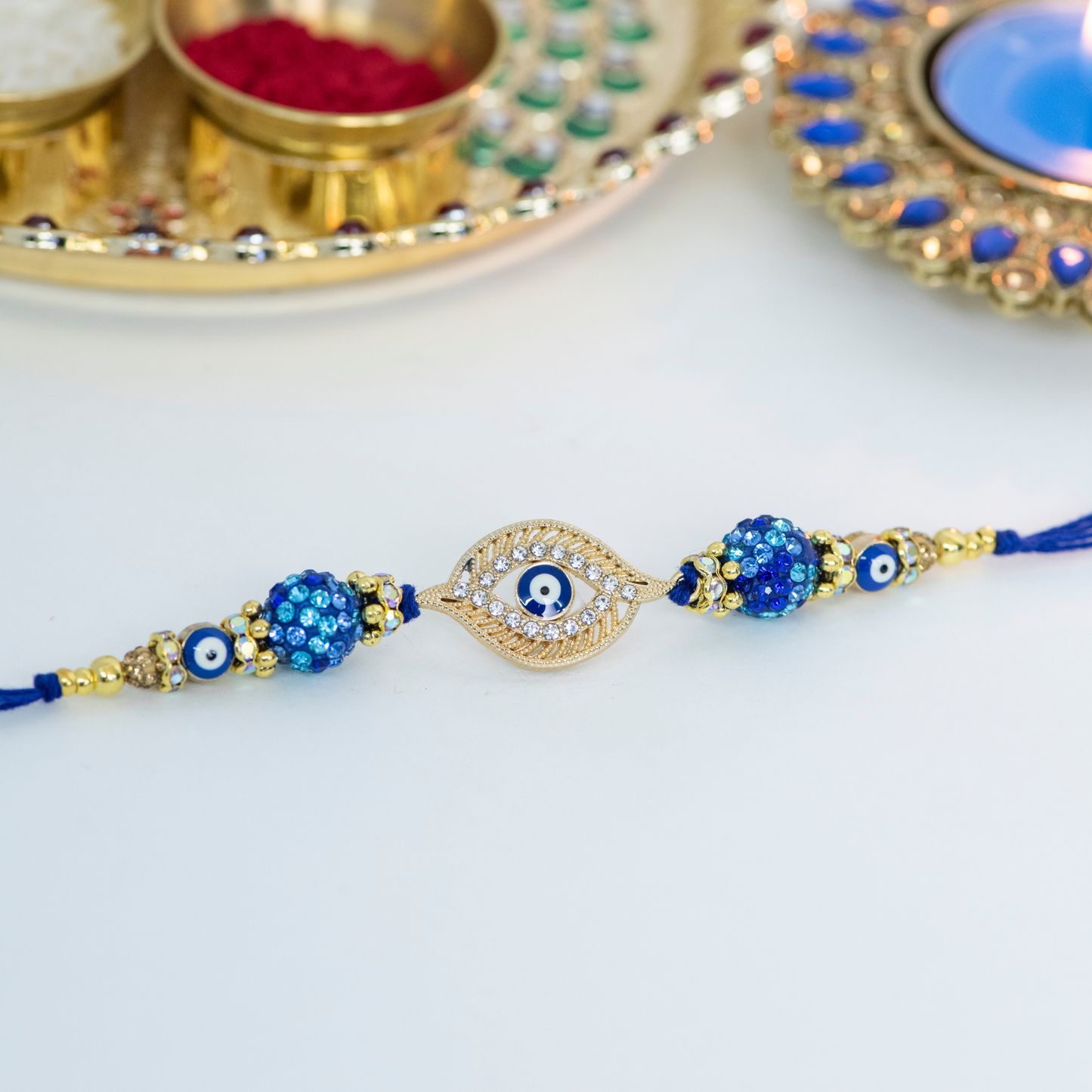 Gold Evil Eye Rakhi with Swarovski's Designer Rakhi