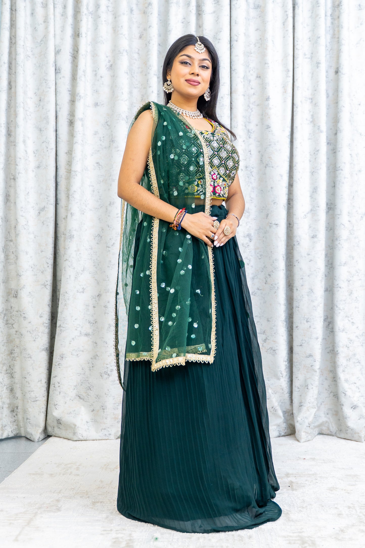 Emerald Green Chiffon Crimped Lehenga Choli with Embroidery and Swarovski Stone Work